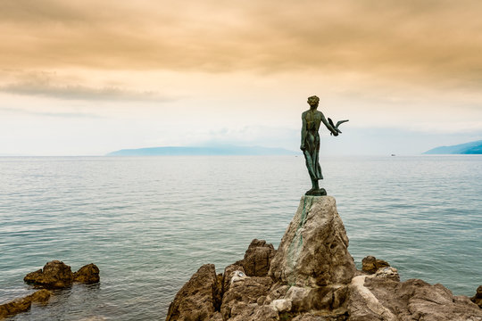 Maiden With The Seagull, sculpture on rock in the Adriatic sea, Opatija, Croatia