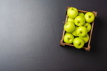 Apples in wooden box with copyspace