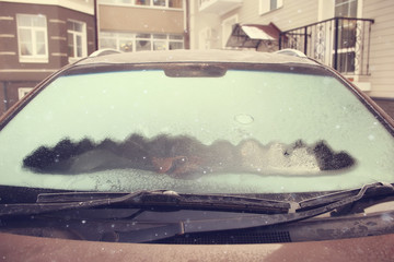 cars on winter road traffic jam city / winter weather on the city highway, the view from car in the fog and snow road