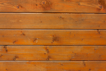Fototapeta premium background of brown-orange boards, selective focus
