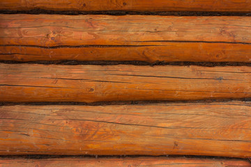 background of brown-orange logs, selective focus