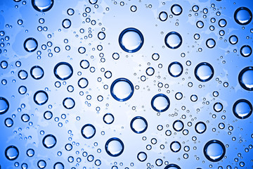 fresh drops background blue glass / wet rainy background, water drops transparent glass blue