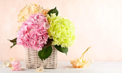 Gordijnen Bouquet of beautiful hydrangea in basket © Svetlana Kolpakova