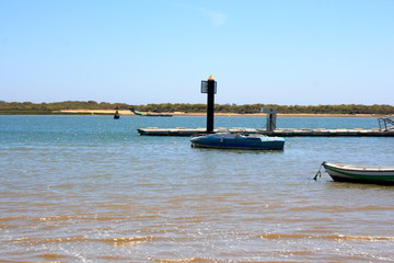 Boat an ships in a spanish beach El Rompido Huelva