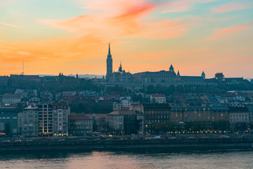 Naklejka premium Sunset view of the Matthias Church and River Danube bank