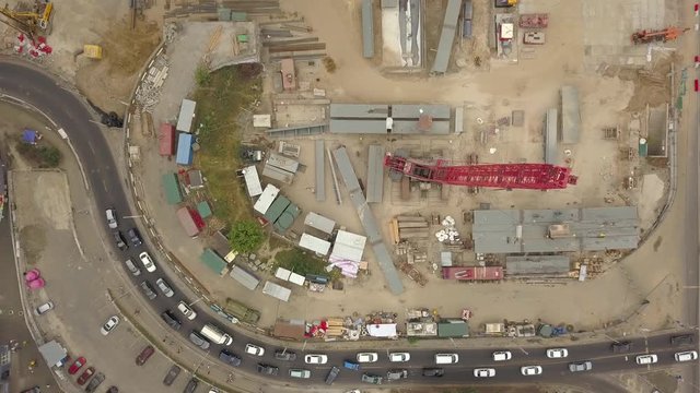 Construction of a new road junction in the city. Aerial view. The construction of the overpass over the highway. Transportation in city traffic