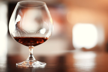 red wine splashing in a glass / glass with red wine in a cafe