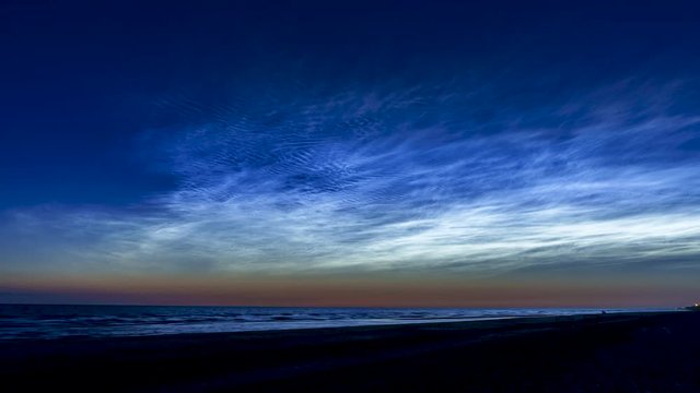 Noctiliucent clouds above the sea at the longest day of the year. Noctilucent clouds, or night shining clouds, are tenuous cloud-like phenomena in the upper atmosphere of Earth.