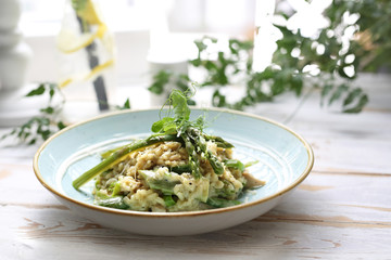Risotto with spinach and green asparagus. Appetizing dish