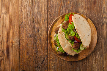 Kebab, kofta in pita, bun. Traditional southern European dish. Top view.