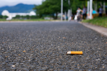 Cigarette littered on sidewalk