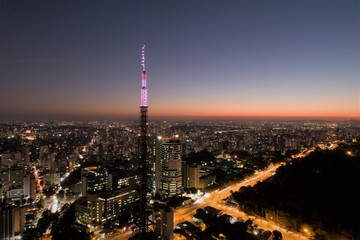 Fototapeta na wymiar Sunset aerial view in São Paulo, Brazil. Great landscape. Explosion of colors on skyline. Business travel. Travel destination.