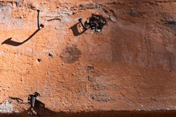 Vintage shabby wall with bent nails