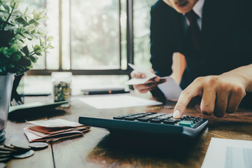 Fototapeta premium Accountant or banker calculate the cash bill.