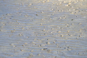 A curved pattern of beautiful sand beach for background backdrop 