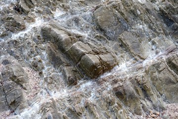 Close up rough surface of a huge sea beach stone for background texture 