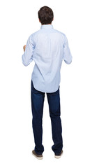 Back view of man in dark jeans. Standing young guy.