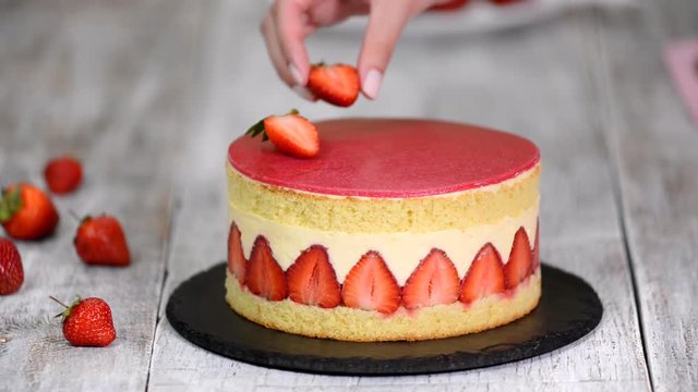 Strawberry cake. Fraisier cake on wooden background