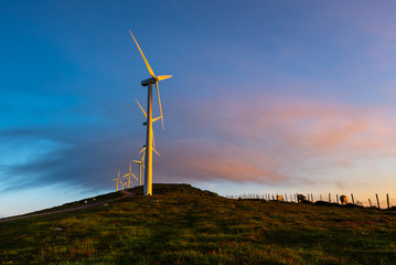 Wind turbines farm at sunrise, Oiz mountain, Basque Country, Spain