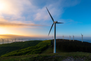 Wind turbines farm at sunrise, Oiz mountain, Basque Country, Spain