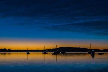 High Clouds, Boats, Reflections and Sunrise on the Bay