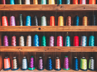 Colourfuls Bobbins on shelf Weaves Thread Textile Fabric Industrial