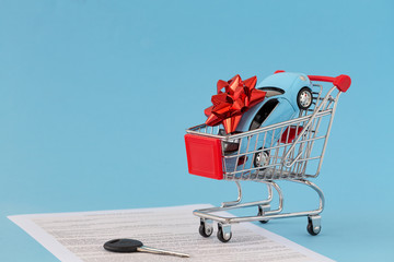 Concept of selling cars on blue background. Sell and buy car, car financing, car key for Vehicle...