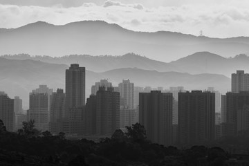 silhouette city skyline and mountain. landscape of Hong Kong at dawn