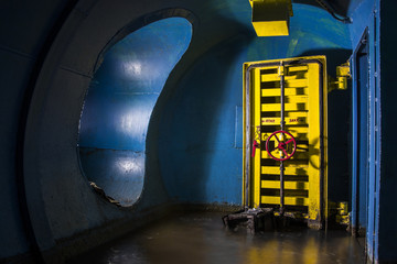 In abandoned bomb shelter 