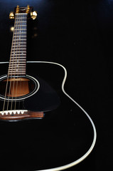 Fototapeta na wymiar Close up of a guitar with shallow depth of field