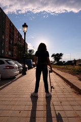 portrait of a teenager skater girl at the city