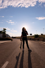 portrait of a teenager skater girl at the city
