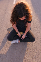portrait of a teenager skater girl at the city
