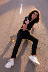 portrait of a teenager skater girl at the city