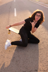 portrait of a teenager skater girl at the city