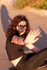 portrait of a teenager skater girl at the city