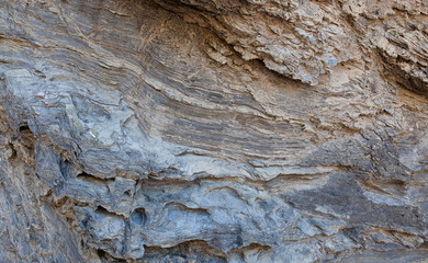 Rock carved by the forces of the waves of the sea. Can be used as background.