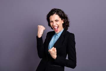 Portrait of ecstatic lady youth shout yeah dressed black blazer classy outfit wavy curly goal...