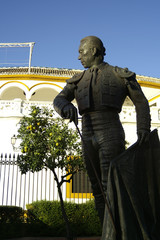 Seville (Spain). Sculpture of the bullfighter Curro Romero next to the Bullring of the city of...