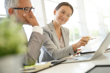 Corporate business coleagues working together in modern office