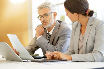 Corporate business coleagues working together in modern office