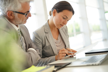 Corporate business coleagues working together in modern office