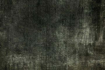 Dark distressed wall grungy background or texture