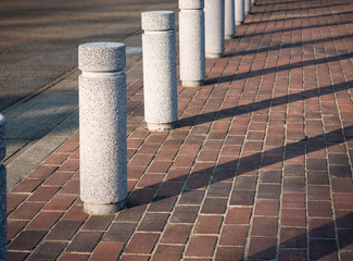 Stone Bollards on street City Pathway Public walkway