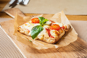 slice of italian pizza in the pizzeria
