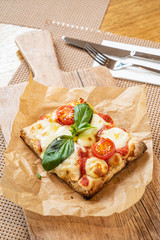 slice of italian pizza in the pizzeria