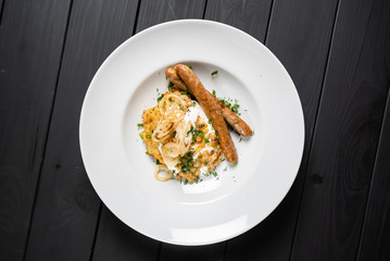 potato pancakes with sausages and fried onion