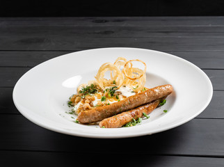 potato pancakes with sausages and fried onion