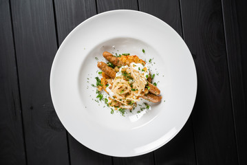 potato pancakes with sausages and fried onion