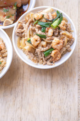 Braised shrimp over rice - Taiwan famous traditional street food. Soy-stewed prawn on cooked rice. Travel concept, top view, copy space, close up